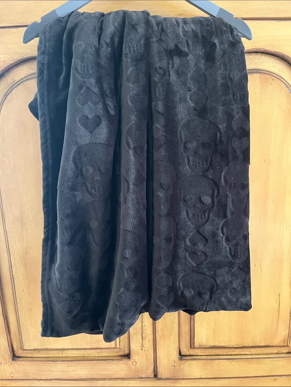 Betsey Johnson Black Microfleece 50" by 70" Throw with Skull & Heart Embossing